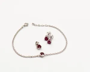 146 Elegant silver 3-piece set, featuring round earrings with 50mm July ruby stones, a matching pendant, and a bracelet with ruby stones.