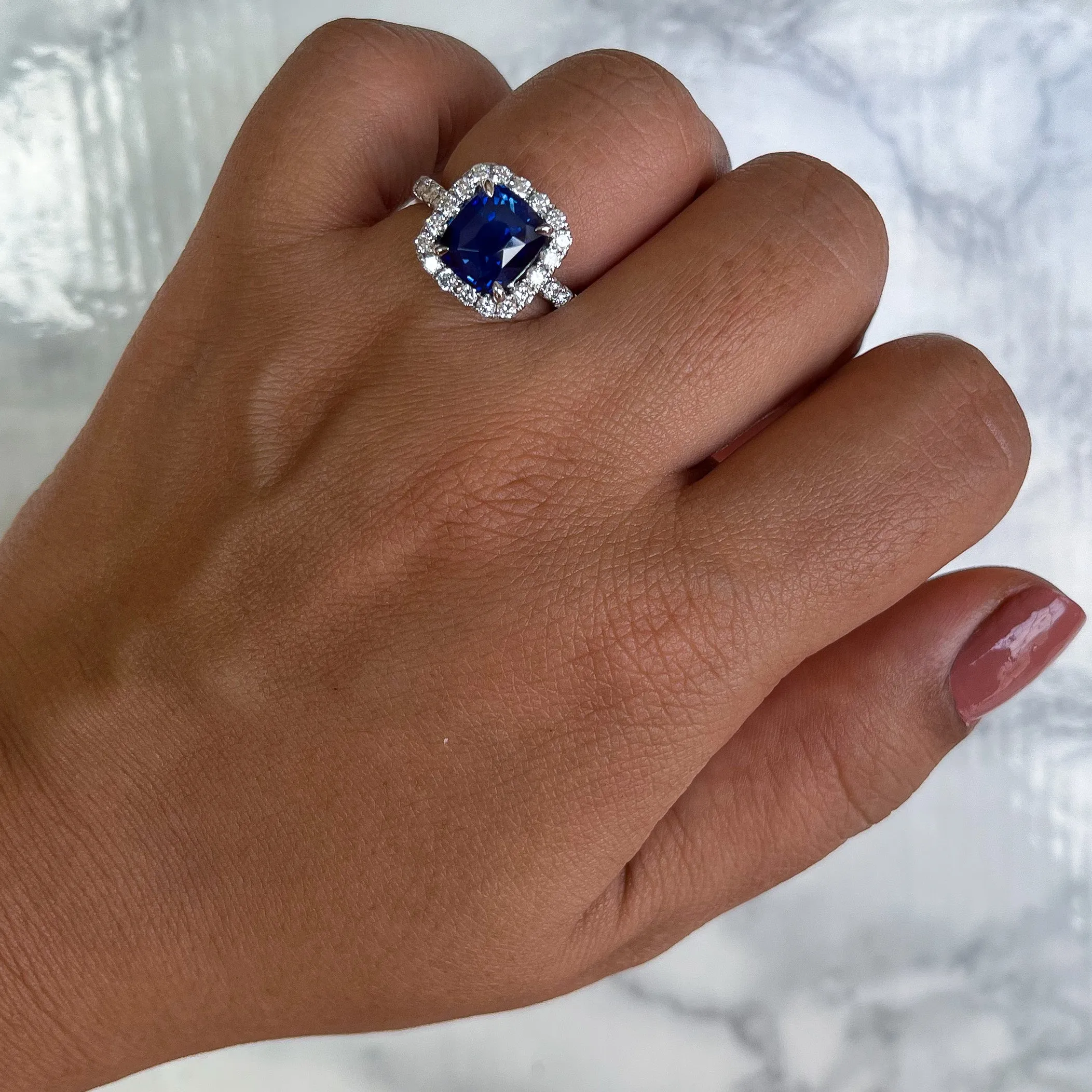 4.41ct. Cushion Blue Sapphire Ring with Diamond Halo in 18K White Gold