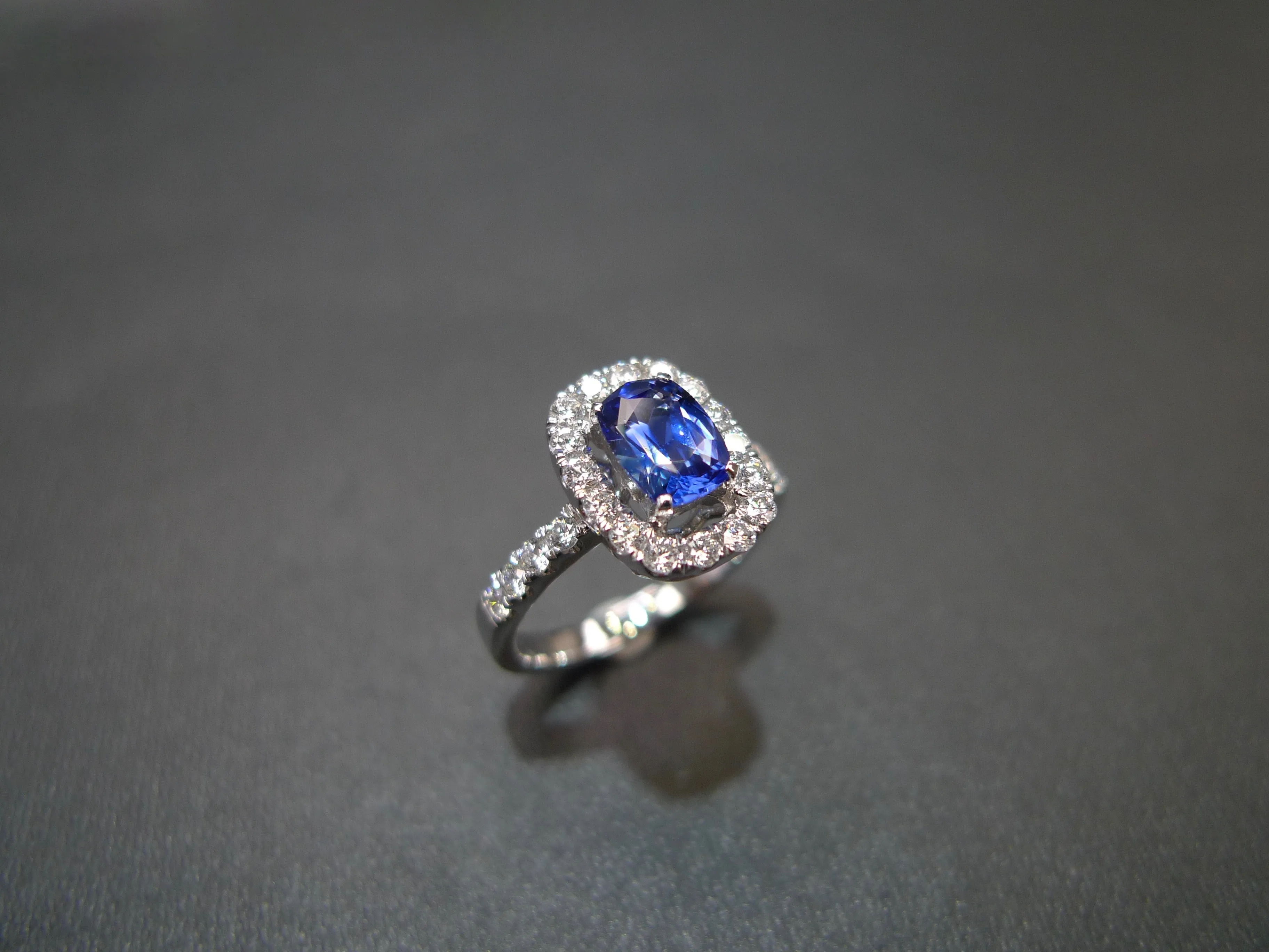 Blue Sapphire and Diamond Halo Ring