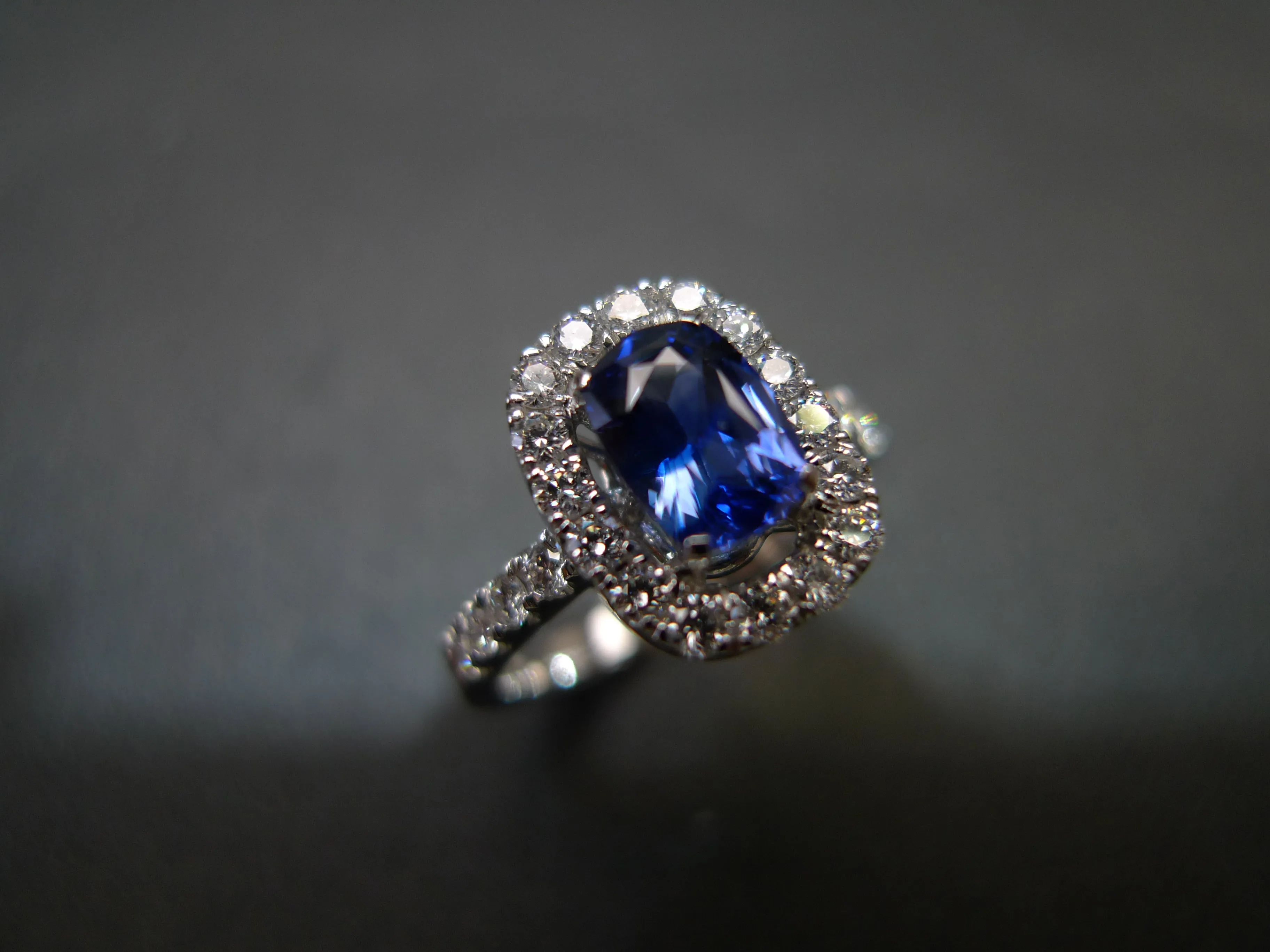 Blue Sapphire and Diamond Halo Ring