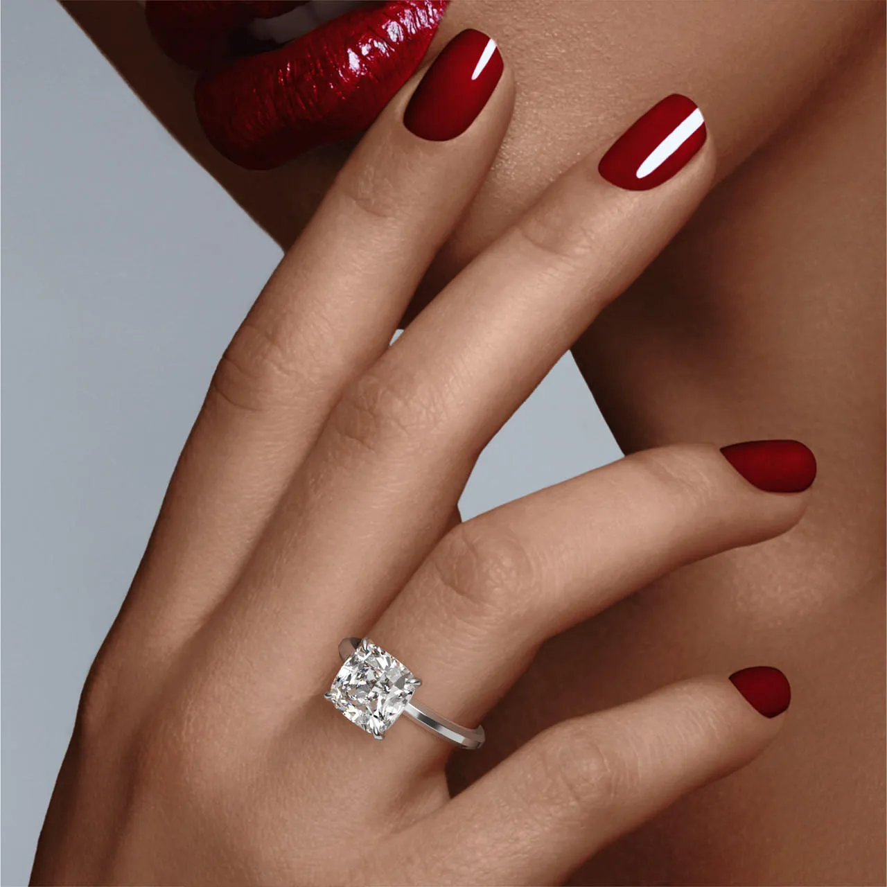 CUSHION CUT DIAMOND ENGAGEMENT RING WITH A CLASSIC 4 PRONG THREE PHASES SLIM SETTING IN PLATINUM