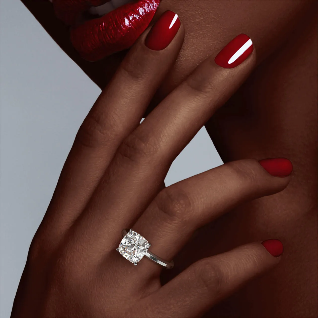 CUSHION CUT DIAMOND ENGAGEMENT RING WITH A CLASSIC 4 PRONG THREE PHASES SLIM SETTING IN PLATINUM
