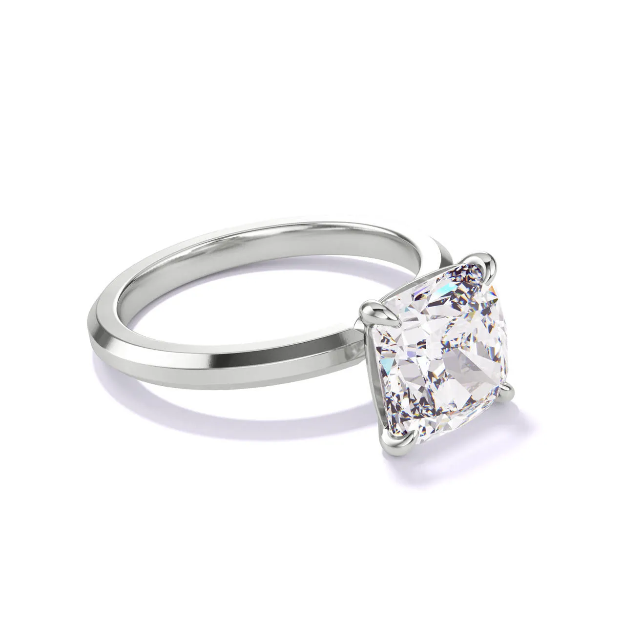 CUSHION CUT DIAMOND ENGAGEMENT RING WITH A CLASSIC 4 PRONG THREE PHASES SLIM SETTING IN PLATINUM