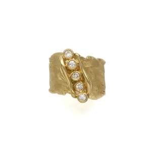 Feathered textured band with a canyon filled bezel set diamonds