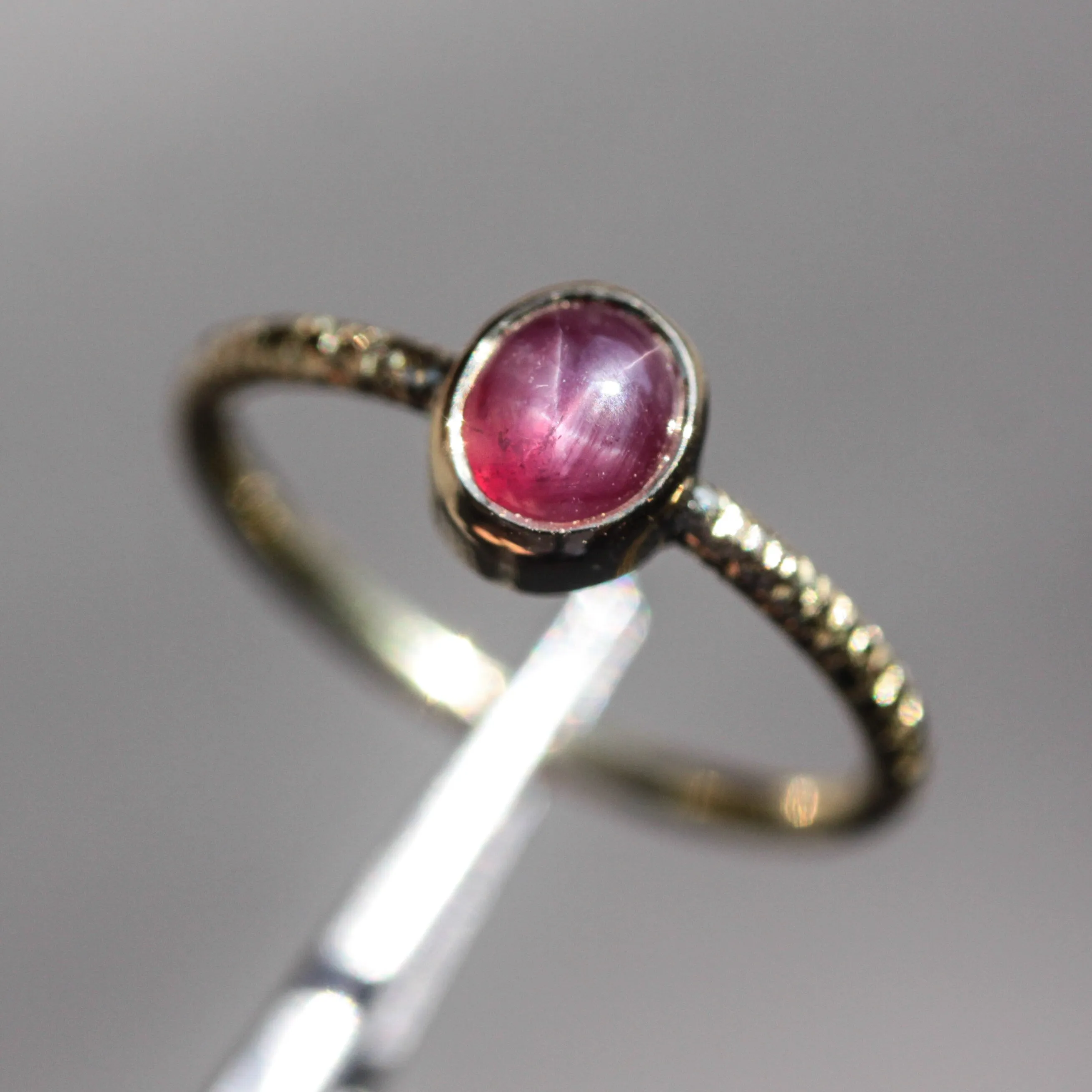Natural star ruby ring in bezel settings with 18k gold texture band