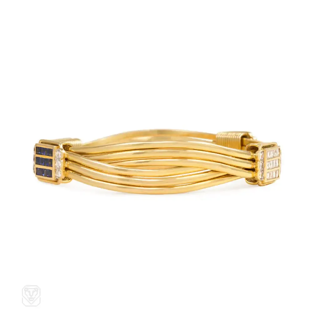 Pair of gold and gemset bangle bracelets
