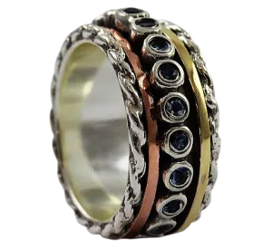 Spinner ring for woman Sterling silver and gold set with green Tourmalines.