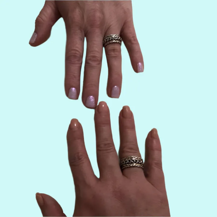 Spinner ring for woman Sterling silver and gold set with green Tourmalines.
