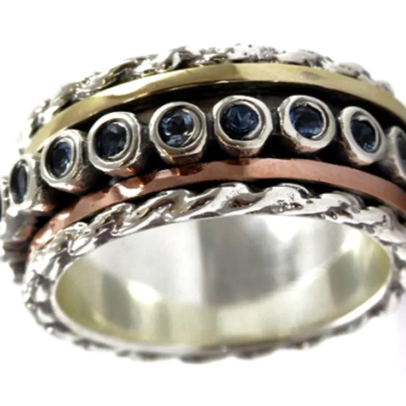 Spinner ring for woman Sterling silver and gold set with green Tourmalines.