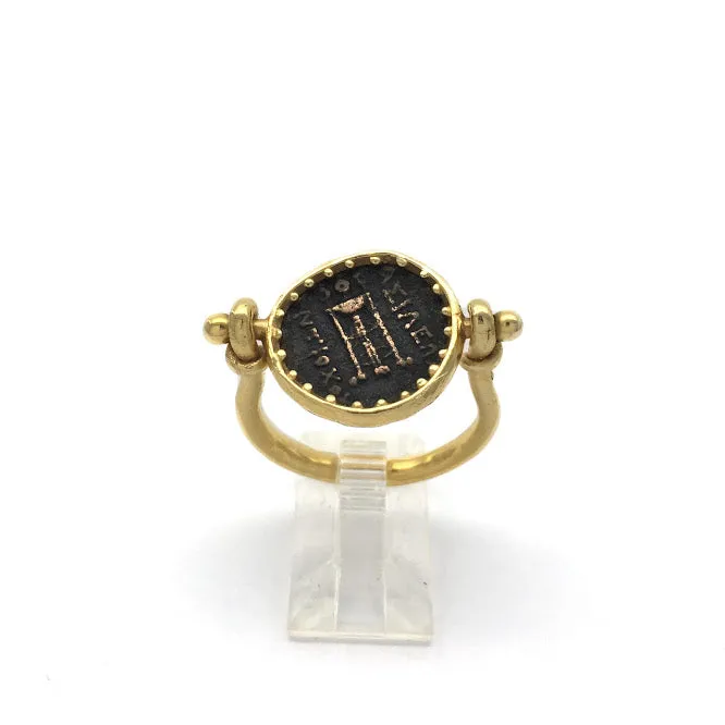Sturup ring featuring an ancient bronze Greek coin with the head of Apollo, set in a way that allows the coin to rotate so that coin can be worn with either side showing